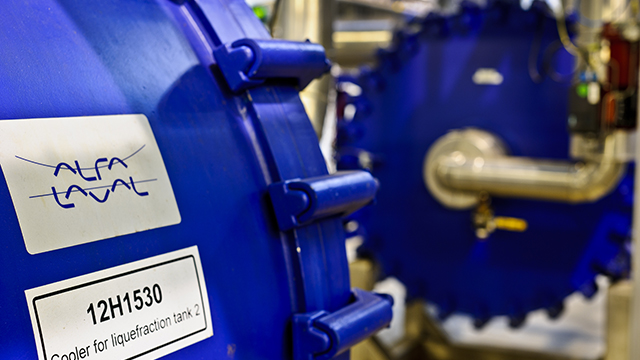 Close up of two blue Alfa Laval welded spiral heat exchangers