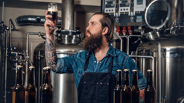 man with beer bottles 640x360